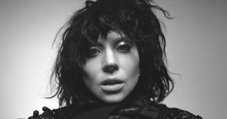 Lady Gaga - Lady Gaga in a black wig, her face close to the camera, in black and white for the cover of her album Mayhem.